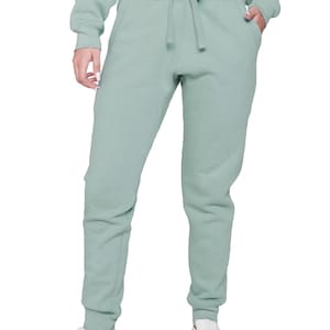 May include: A light green sweat suit, including a crew neck sweatshirt and matching sweatpants. The sweatpants have a drawstring waist and cuffed ankles. White sneakers complete the casual outfit. The clothing is made of a soft, comfortable material.