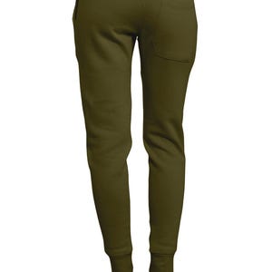 May include: Olive green sweatpants with a back pocket and elastic cuffs. The pants are shown from the back, with white shoes visible at the bottom. The material appears to be soft and comfortable.
