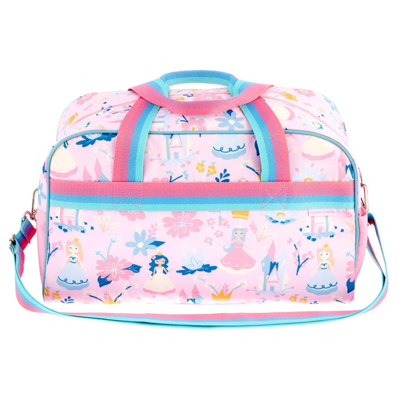 May include: A light pink duffel bag featuring a repeating pattern of illustrated princesses, castles, crowns, and flowers. The bag includes dual top handles and an adjustable shoulder strap, both designed with horizontal stripes in pink and blue.