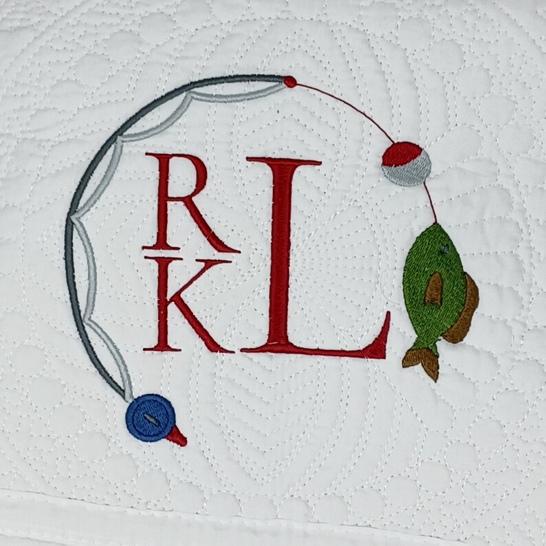 100% cotton White quilt with a monogram and fishing themed frame of a fishing Rod and a fish designed in a circle pattern with the monogram inside.