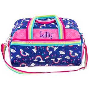 Front view of the rainbow pattern duffle bag with name, has carry handles and shoulder strap. One large open area and 2 small side pockets on the our side,