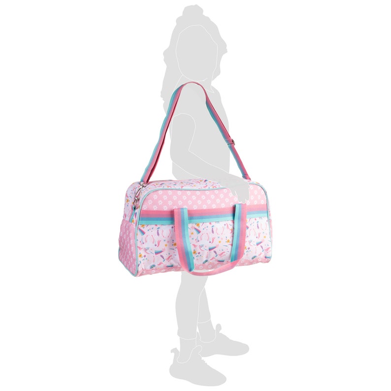 May include: A pink duffel bag featuring a repeating pattern of unicorns, rainbows, and small flowers. The bag includes two short handles and a long, adjustable shoulder strap, both designed with horizontal stripes in shades of pink and light blue.