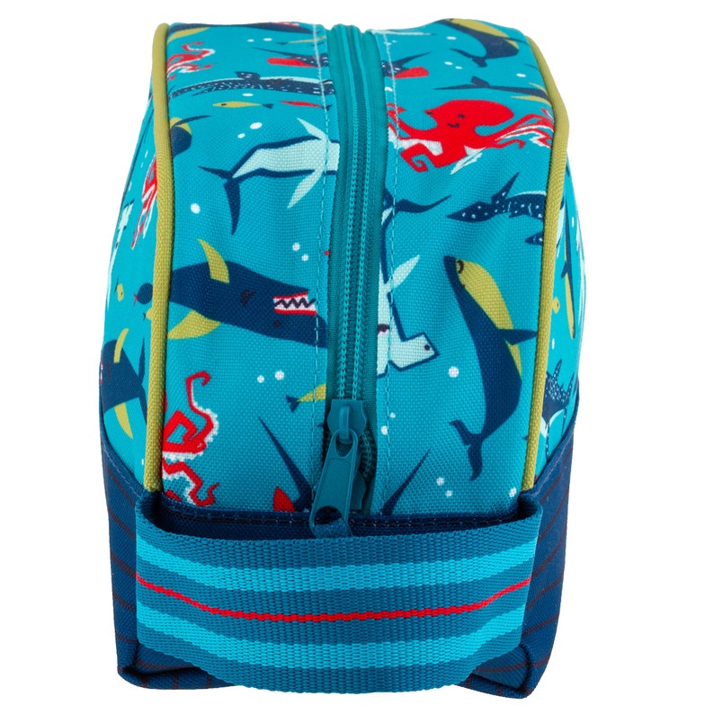 May include: A blue toiletry bag with a zipper closure and a colorful sea creature print. The bag has a blue and red striped strap.