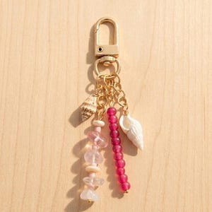Charm de sac doré coquillage véritable Pink Sands