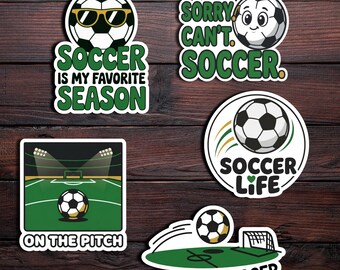 May include: A collection of soccer-themed stickers with various designs. One sticker features a soccer ball wearing sunglasses with the text "Soccer is my favorite season." Other stickers include phrases like "Sorry, can't. Soccer" and "Goal Digger."