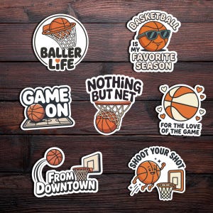 May include: A collection of basketball-themed stickers with various designs. The stickers feature basketballs, hoops, and phrases like "Baller Life," "Game On," and "Nothing But Net." The color scheme includes orange, white, and black, with a cartoonish style.