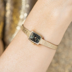 Black cocktail watch for woman 90s authentic Seagull gift, gold plated Roman numerals dial watch rectangular, sleek bracelet chevron pattern