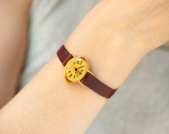 Reloj de pulsera ovalado para mujer Dawn, en perfecto estado, micro reloj para dama chapado en oro, reloj retro con números romanos para niña, regalo, correa de piel auténtica nueva.