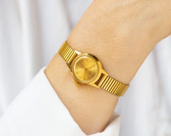 Montre vintage pour femme, modèle Dawn classique plaqué or, montre-bracelet antichoc, bijou pour femme, petite montre ronde, bracelet neuf en cuir véritable