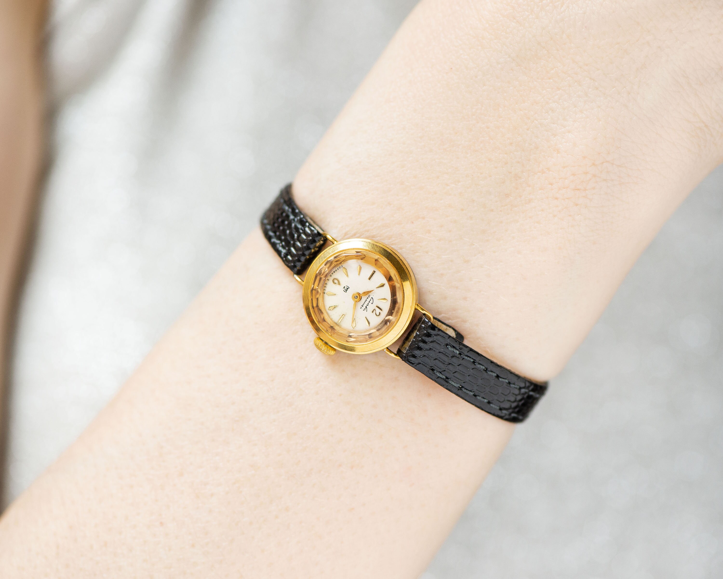 tiny gold watch