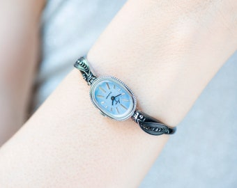 Mint condition women cocktail watch oval blue dial leaf trim on bangle, vintage watch for women Ray silver shade, classic jewelry bracelet