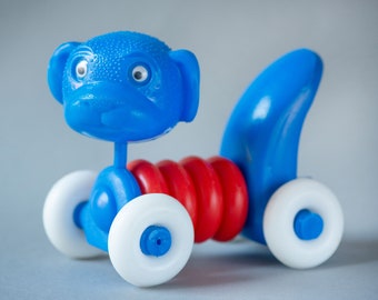 Vintage plastic dog puppy toy assembled kid's toy, blue red white white on wheels doggy moving neck toy eye rolling dog nursery room decor