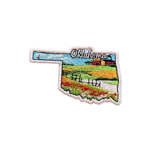 May include: Embroidered patch in the shape of Oklahoma, featuring a landscape scene with fields, a house, and the word "Oklahoma" in script. The patch has a white border and is designed with vibrant colors.