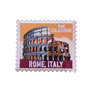May include: Embroidered patch in the shape of a postage stamp featuring the Colosseum in Rome. The patch has a tan background with the text "THE COLOSSEUM" and "ROME, ITALY". The Colosseum is depicted in shades of grey and brown.