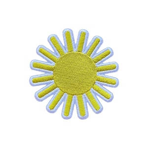 May include: Embroidered patch of a yellow sun with white and yellow rays. The sun has a textured, stitched appearance, with a white border. The patch is designed to be ironed on or sewn onto fabric, suitable for clothing or accessories.