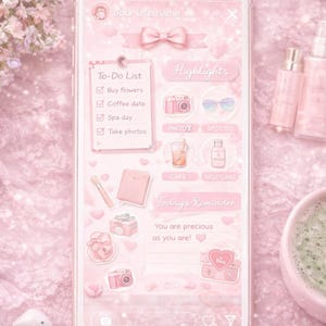 May include: A pink smartphone screen displays a to-do list, highlights, and reminders. The screen features icons of a camera, sunglasses, and a drink. The background is a soft pink with a floral arrangement and other accessories.