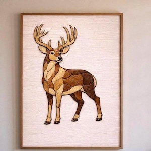 May include: Wooden art piece featuring a deer with large antlers. The deer is crafted from various shades of brown wood, creating a mosaic effect. The artwork is framed in a light brown wooden frame, set against a white background.