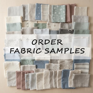 May include: A selection of fabric swatches in diverse colours and patterns, including floral, striped, and plain designs. The text "ORDER FABRIC SAMPLES" is displayed across the centre. The fabrics are arranged on a light-coloured surface.