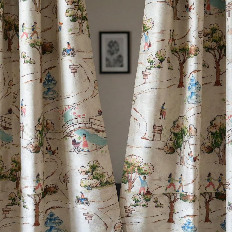 May include: Cream-colored curtains with a whimsical park scene print. The design features trees, pathways, bridges, and figures engaged in various activities. The color palette includes shades of green, blue, and brown, creating a soft, inviting aesthetic.