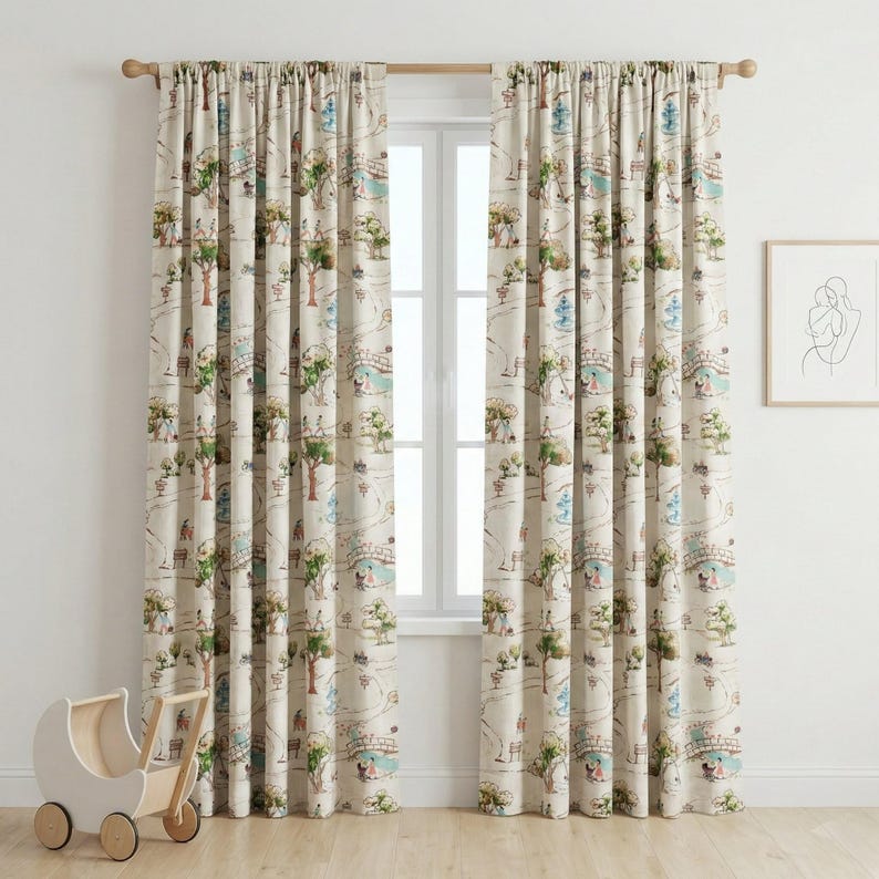 May include: Two beige curtain panels with a whimsical illustrated design of a park scene, featuring trees, bridges, and figures in shades of green, blue, and brown. The curtains are hanging on a wooden rod.