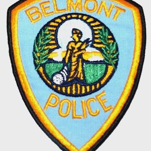 May include: A set of three ceramic mugs with a speckled, matte finish. The mugs are in shades of cream, light gray, and dark gray. Each mug has a simple, minimalist design and a rounded handle.