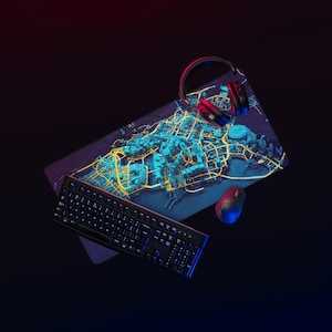 May include: A gaming setup with a black keyboard, a red and black headset, and a red mouse. A large mousepad displays a detailed city map in blue and yellow. The setup is illuminated with blue and red lighting.
