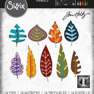 Puede incluir: Un conjunto de 18 formas de hojas troqueladas en varios colores y patrones. Las hojas están diseñadas por Jim Holtz y forman parte de la colección Sizzix Thinlits. El número de producto es 666380.