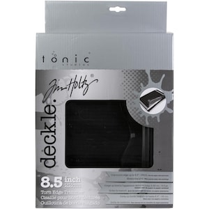 May include: A black Torn Edge Trimmer by Tonic Studios, with a measuring grid, cuts up to 8.5 inches. The product is in a gray box with the text "deckle." and "Jim Holtz" printed on it.