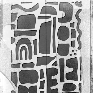 May include: A black and white stencil with an abstract geometric design. The stencil is labeled "STENCIL" and "Jim Holtz Collection" and is for use with inks, paint, pastes, and more.