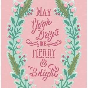May include: A pink card with a festive design. The card features a wreath of green leaves and pink berries surrounding the text "MAY YOUR DAYS BE MERRY & BRIGHT" in a stylized font. The background is a solid pink color.