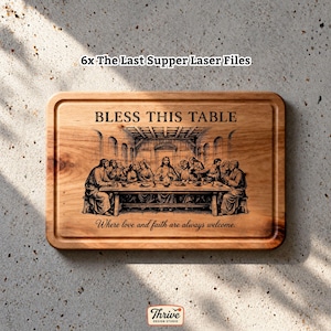 May include: A rectangular wooden cutting board featuring a laser-engraved depiction of The Last Supper. The text "BLESS THIS TABLE" appears above the image, and "Where love and faith are always welcome." is engraved below the scene.