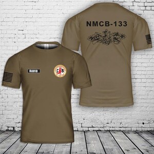 May include: A brown t-shirt with the text "DAVID" above a circular emblem and an American flag on the sleeve. The back of the shirt displays "NMCB-133" and a graphic design.