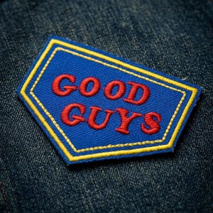 May include: A white ceramic mug with a black handle and the text "But First, Coffee" in a black, bold font. The mug is on a white surface. The mug is approximately 4 inches tall.