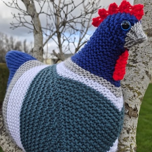 May include: A set of three ceramic mugs with a speckled, matte finish. Each mug features a different color: light blue, cream, and gray. The mugs have a simple, modern design and a comfortable handle.