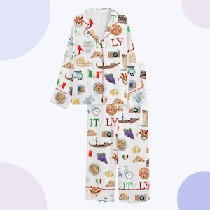 May include: White pyjama set featuring a pattern of Italian imagery, such as pizza slices, gondolas, and the word "ITALY". The long-sleeved top and trousers have red edging.