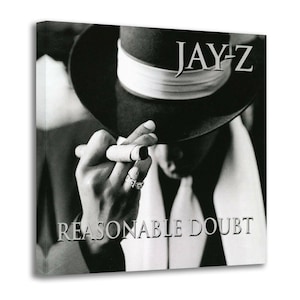 May include: Black and white image of a person wearing a fedora and holding a cigar. The text "JAY-Z" is above the hat, and "REASONABLE DOUBT" is below. The person is wearing a ring.