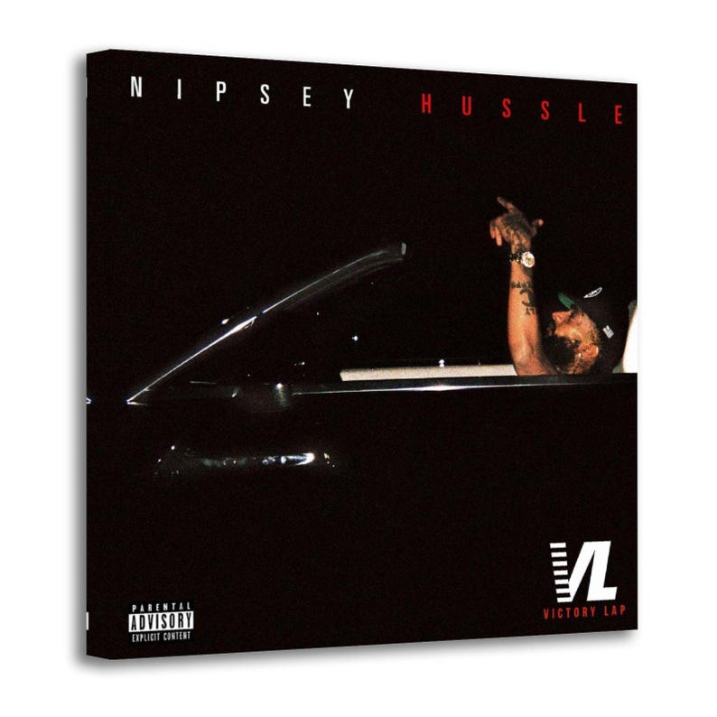 May include: A canvas print featuring the album cover for "Victory Lap" by Nipsey Hussle. The image shows a person in a car with their arm raised. The album title is at the top, and the "Parental Advisory" label is visible.