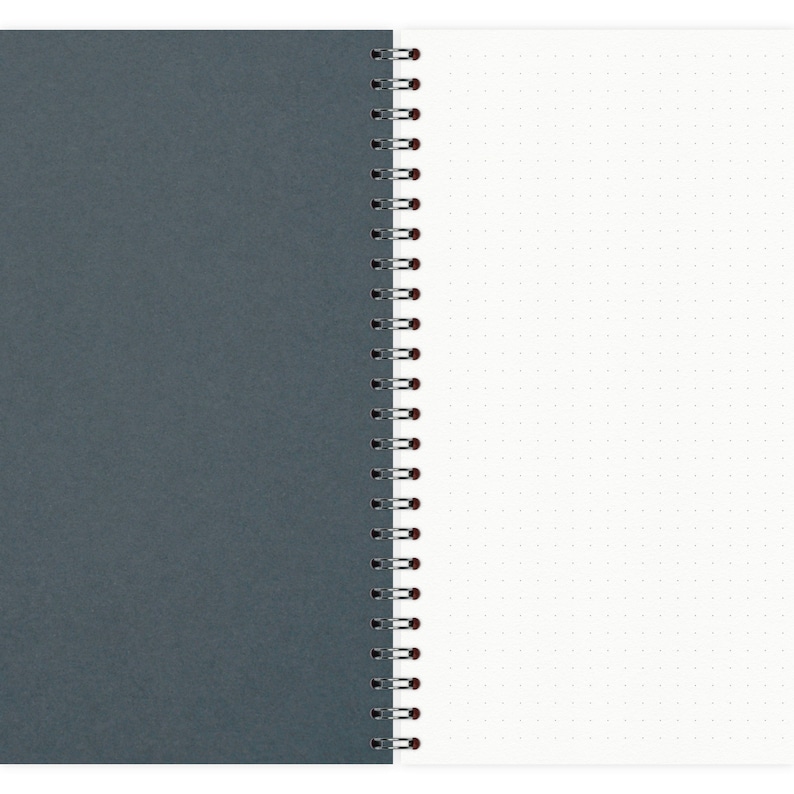 May include: A gray spiral bound notebook with a white dotted page on the right side.