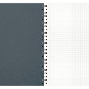 May include: A gray spiral bound notebook with a white gridded page on the right side.