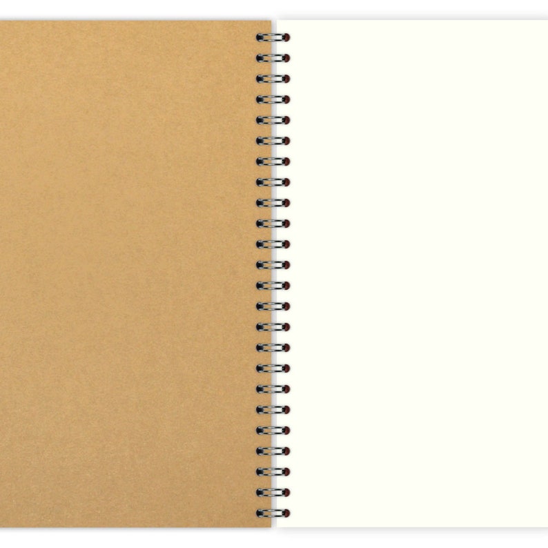 May include: A brown cardboard notebook with a white spiral binding. The notebook is open to a blank white page.