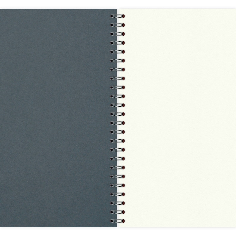 May include: A gray and white spiral bound notebook with a dark gray cover and white pages.