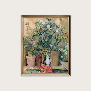 May include: A framed painting of potted plants with white and pink flowers, green leaves, and a small white pitcher. The painting has a gold frame and a neutral background. A red and patterned cloth is draped near the pitcher.