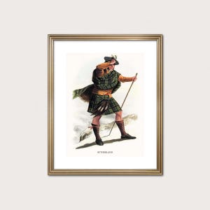 May include: A framed print depicting a man in traditional Scottish Highland dress. He wears a green and brown tartan kilt, shawl, and hat, and holds a staff. The print includes the word "SUTHERLAND" at the bottom.