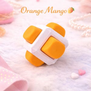 May include: A set of three ceramic mugs with a speckled, matte finish. The mugs are in shades of cream, light gray, and dark gray. Each mug has a simple, modern design and a rounded handle.