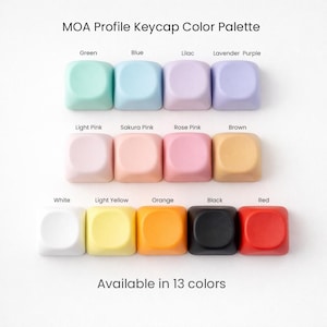 May include: A colour palette of MOA profile keycaps in 13 colours, including green, blue, lilac, lavender purple, light pink, sakura pink, rose pink, brown, white, light yellow, orange, black, and red. Text reads "Available in 13 colours."