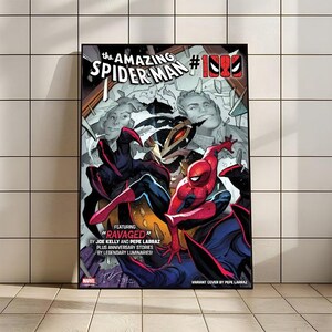 Peut inclure: Une couverture de bande dessin&eacute;e encadr&eacute;e pour "The Amazing Spider-Man #1000". L'&oelig;uvre d'art pr&eacute;sente Spider-Man dans une pose dynamique, avec un costume rouge et bleu, sur fond d'autres personnages et le texte "RAVAGED".
