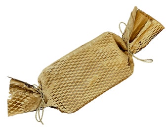 May include: A brown paper honeycomb packing material tied with twine. The packing material is shaped like a long, thin cylinder.