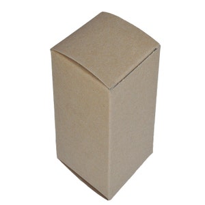 May include: A plain brown cardboard box with a slightly rounded top.