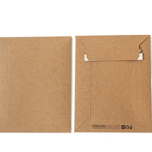 May include: Two brown cardboard envelopes with a white flap on the top of the right envelope. The right envelope has the text "ECODENCLOSE" printed on the bottom.