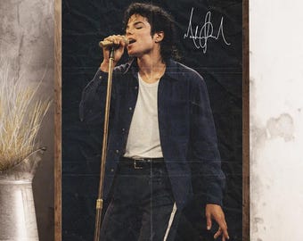 May include: A framed poster featuring a vintage image of Michael Jackson singing into a microphone. He wears a white t-shirt under a dark blue button-down shirt and black pants. The poster includes his signature in white.